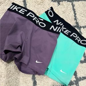 two pairs of nike pros, perfect condition